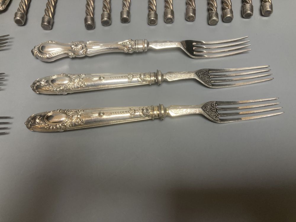 Twelve plated toasting forks and a set of six Victorian Elkington Mason & Co plated dessert knives and forks